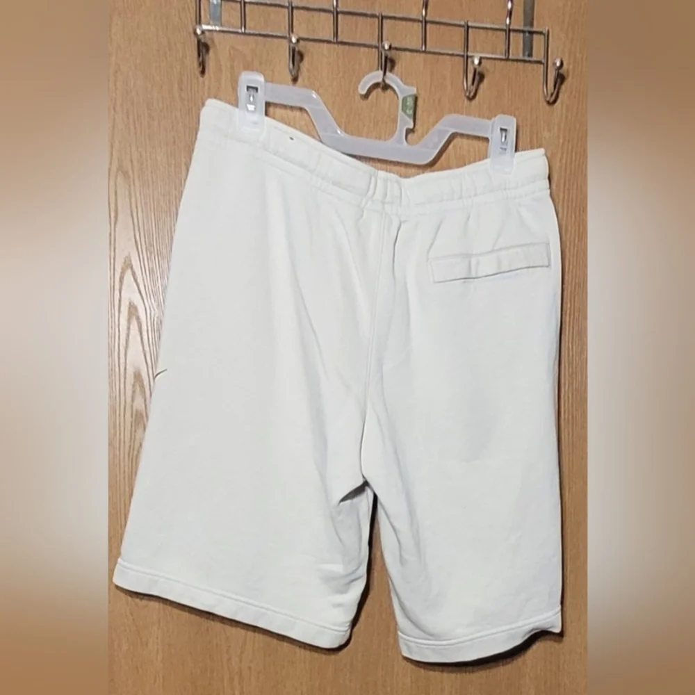 Nike beige with black big logo,pre-loved men shorts.Size : Medium